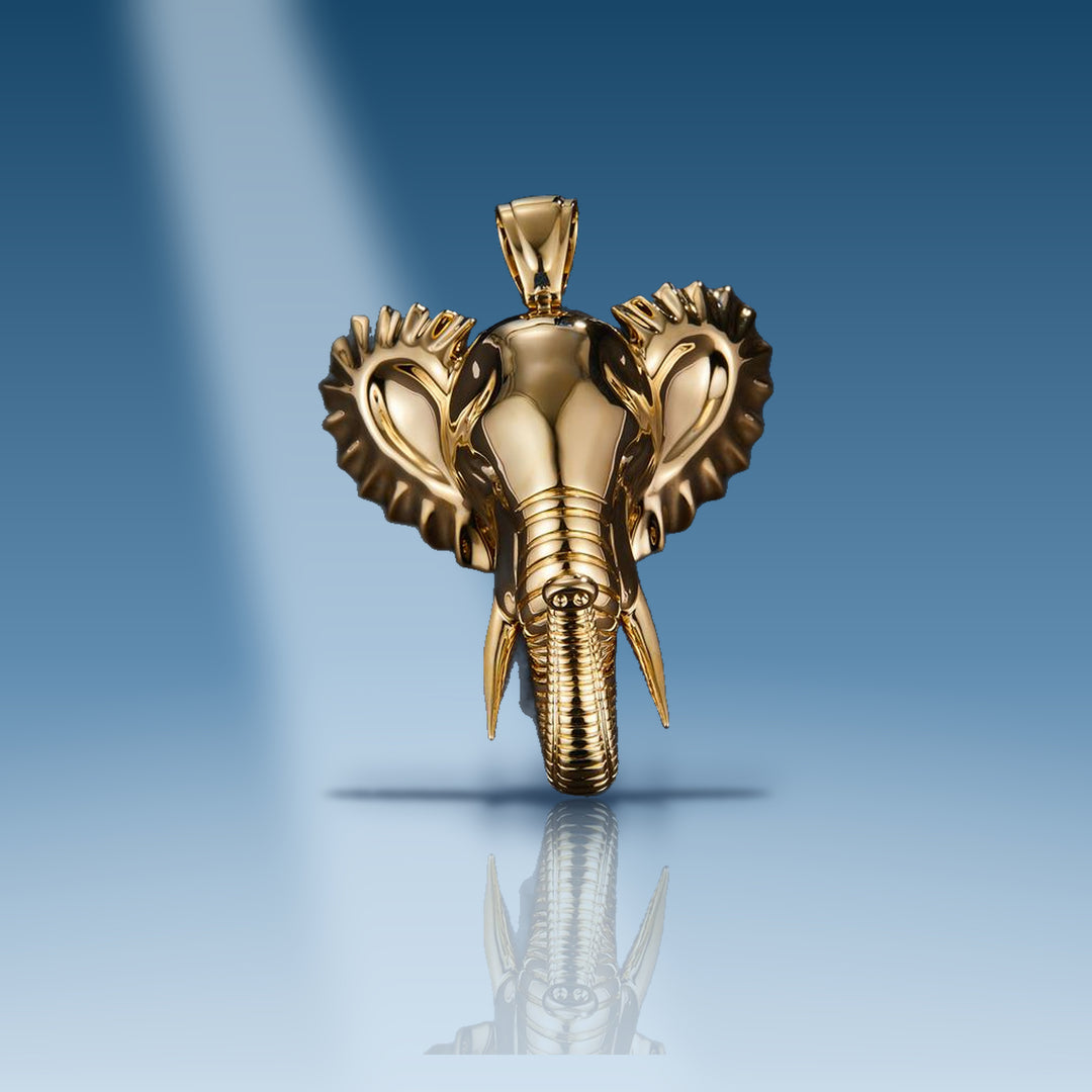 Yellow gold elephant head with tusk pendant