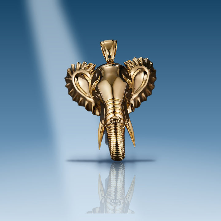 Yellow gold elephant head with tusk pendant
