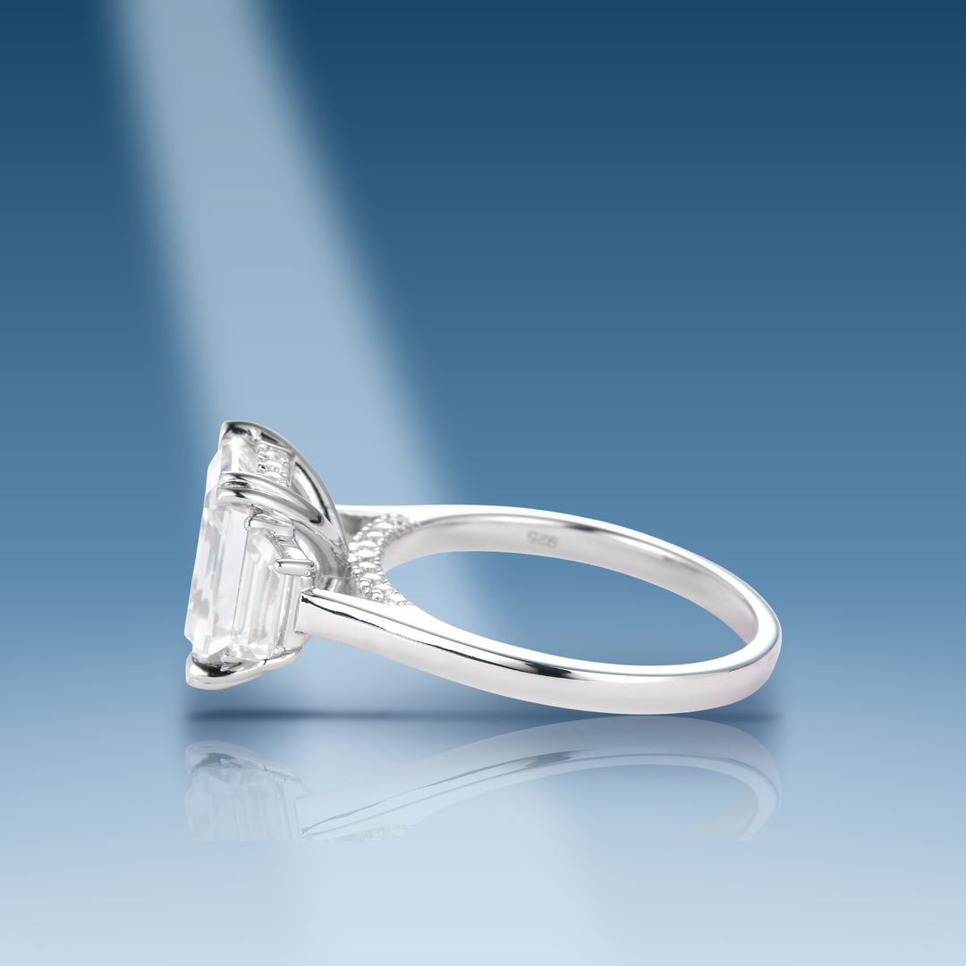 4.18 Ct. Moissanite Sterling Silver Solitaire Emerald Cut Ring on blue
