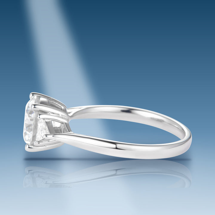 Sterling silver moissanite solitaire with round center trilliant cut side stones ring