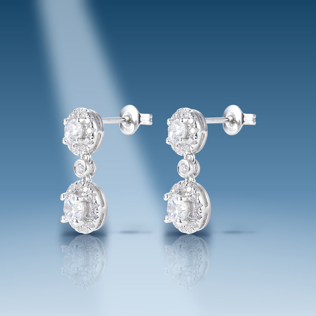 1.44 Ct. Moissanite Sterling Silver Dangle Earrings on blue
