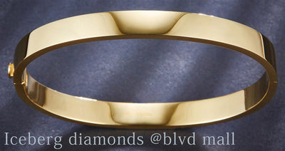 18 Kt Gold (Yellow). Plain Hard Bangle Oblong 2.5"X1.7" Bracelet. (Women). 2.5 in Long. 6.3 mm Wide