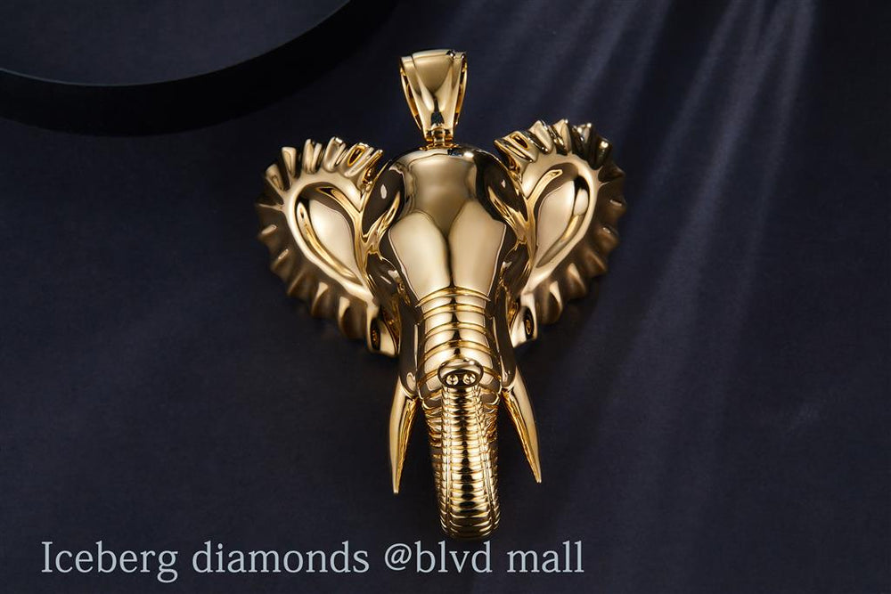 Yellow gold elephant head with tusk pendant, view 2