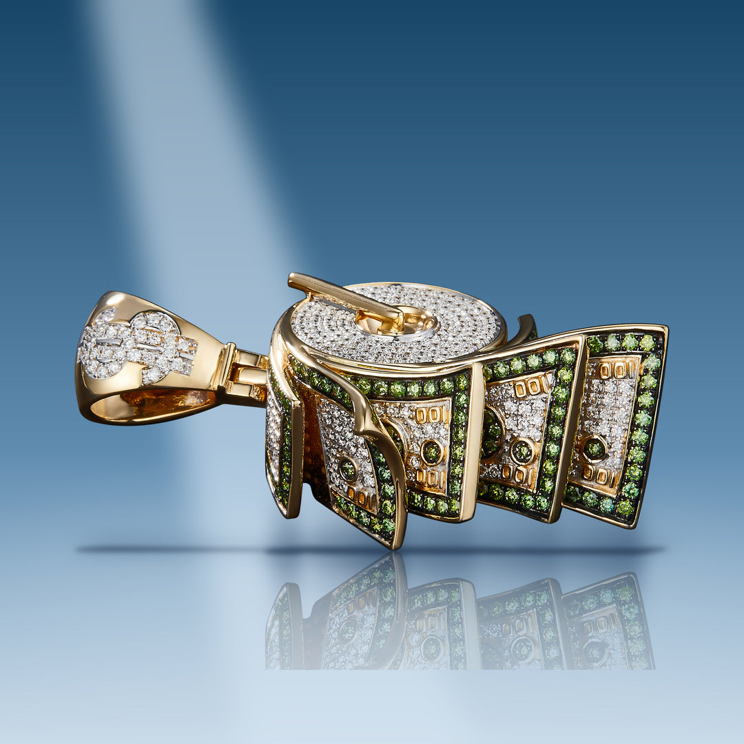 Yellow gold diamond money roll with green diamonds pendant