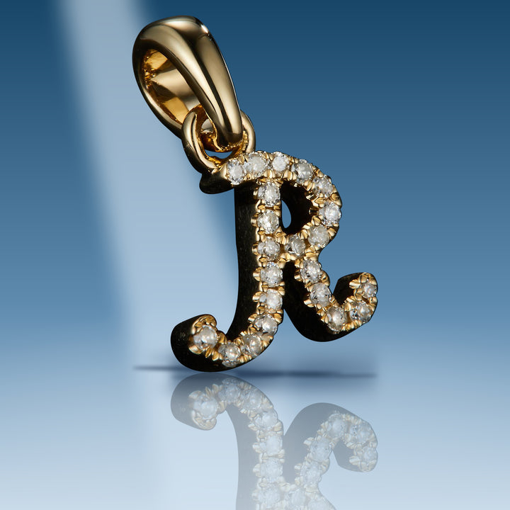 Yellow gold diamond initial letter R pendant