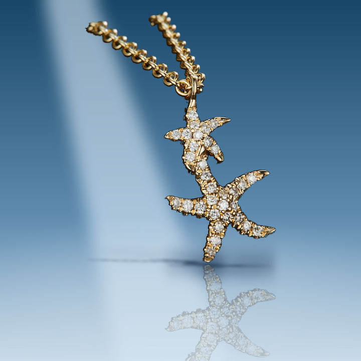 Yellow gold diamond double star fish pendant