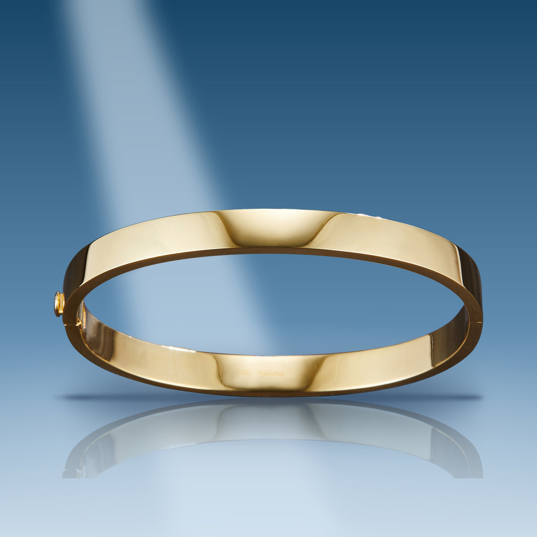 Yellow gold plain hard bangle oblong bracelet