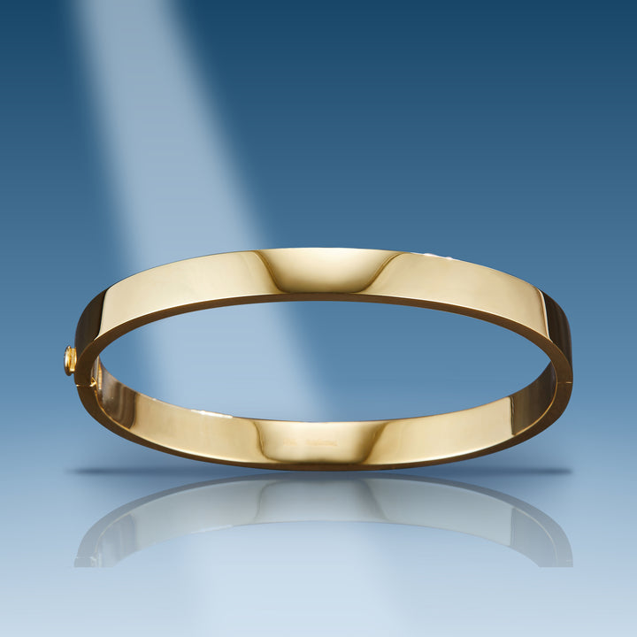 Yellow gold plain hard bangle oblong bracelet