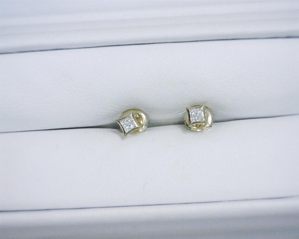 0.031 Ct. Diamond 10 Kt Gold (Yellow). Studs Earrings. (Unisex).