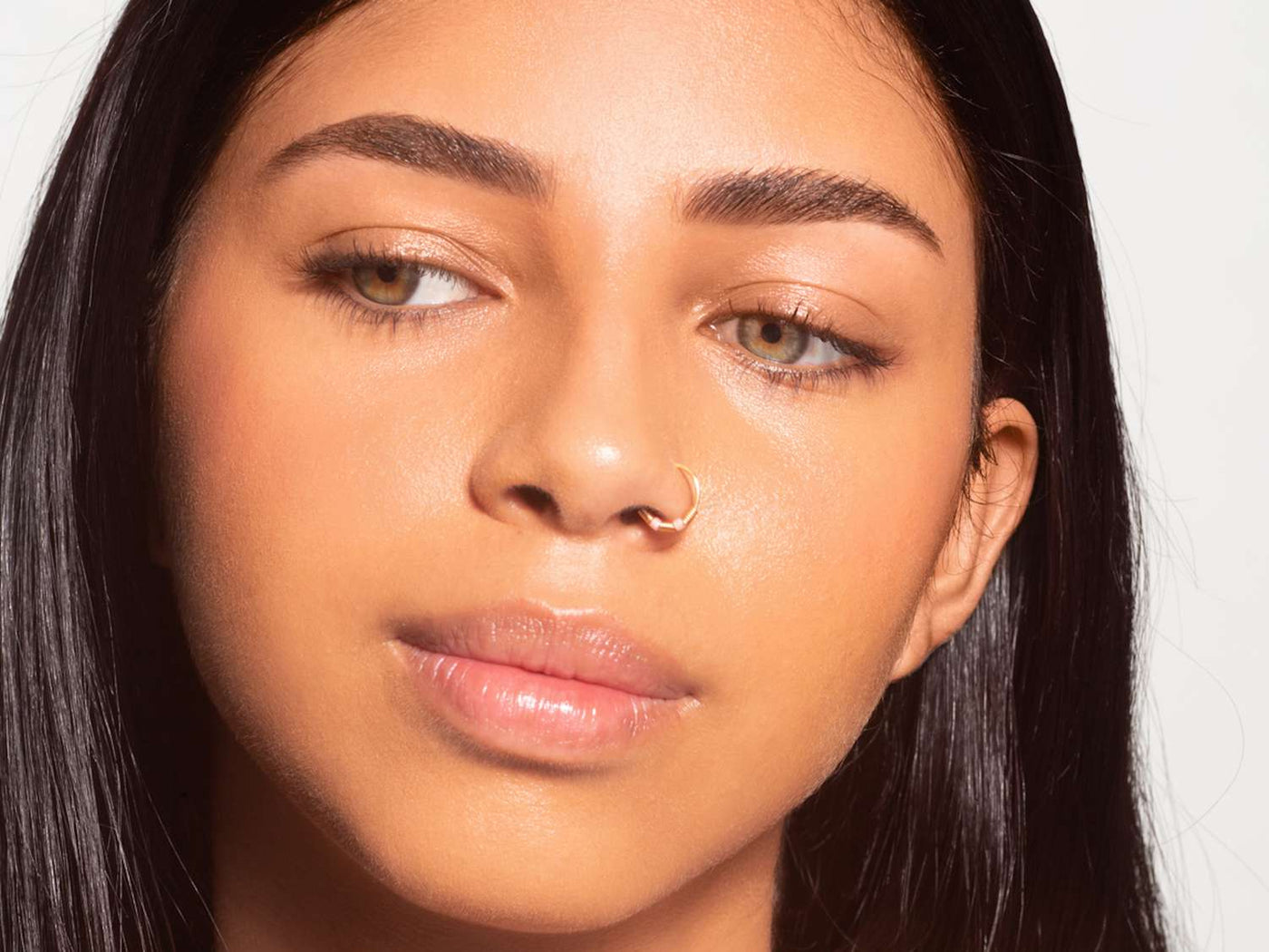 a woman with a nose ring