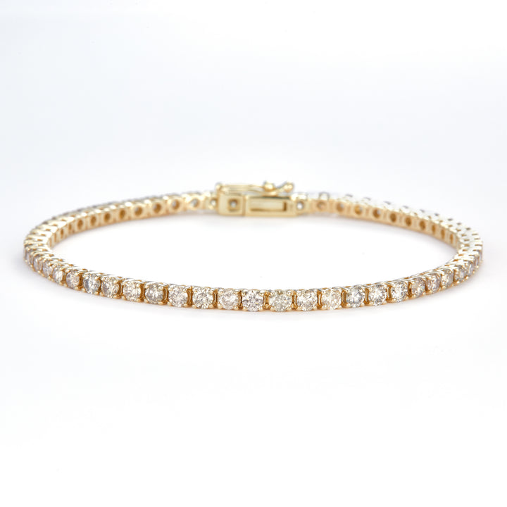 3.862 Ct. Diamond 10 Kt Gold (Yellow). TENNS Bracelet. (Unisex). 7.5 in Long. 2.5 mm Wide