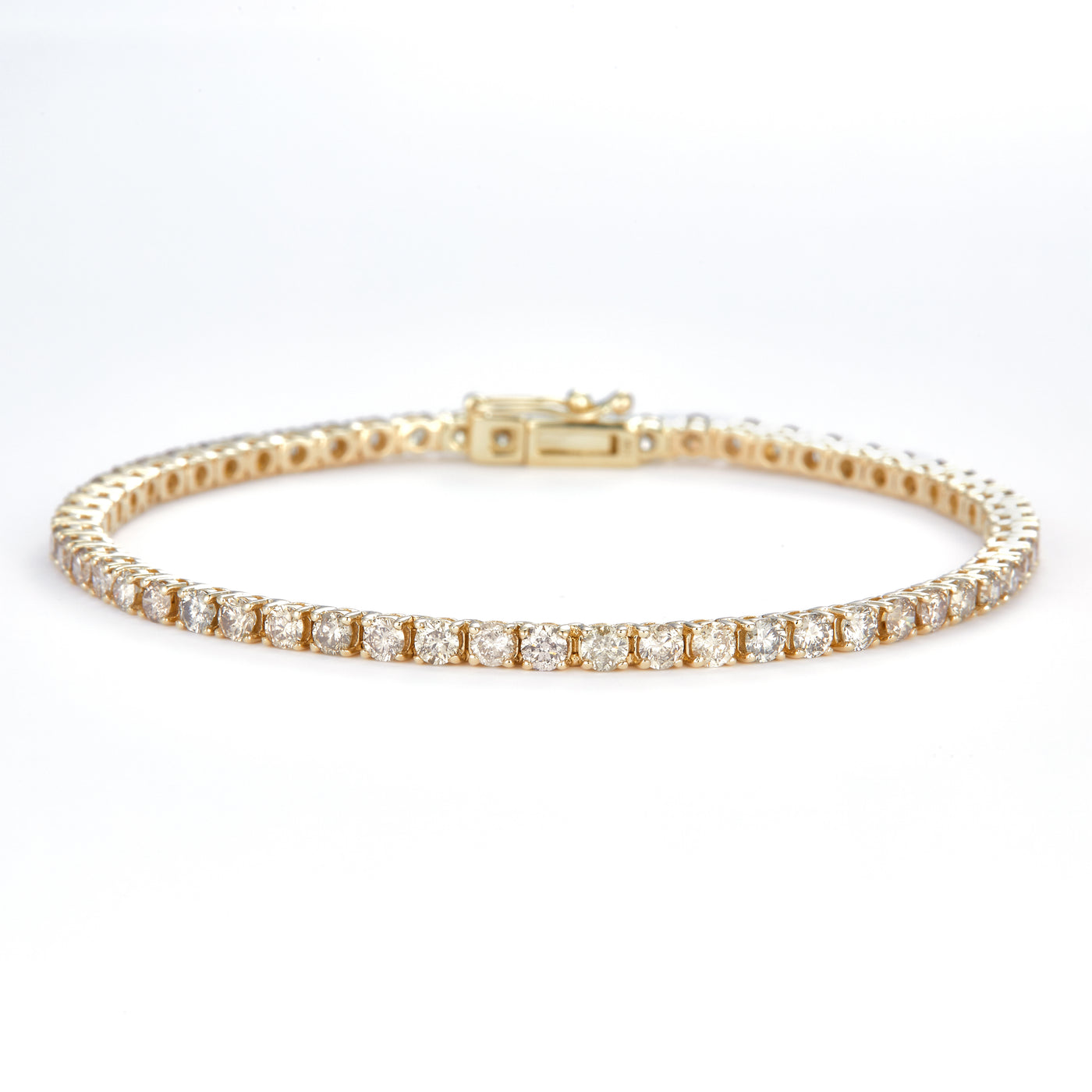 3.862 Ct. Diamond 10 Kt Gold (Yellow). TENNS Bracelet. (Unisex). 7.5 in Long. 2.5 mm Wide
