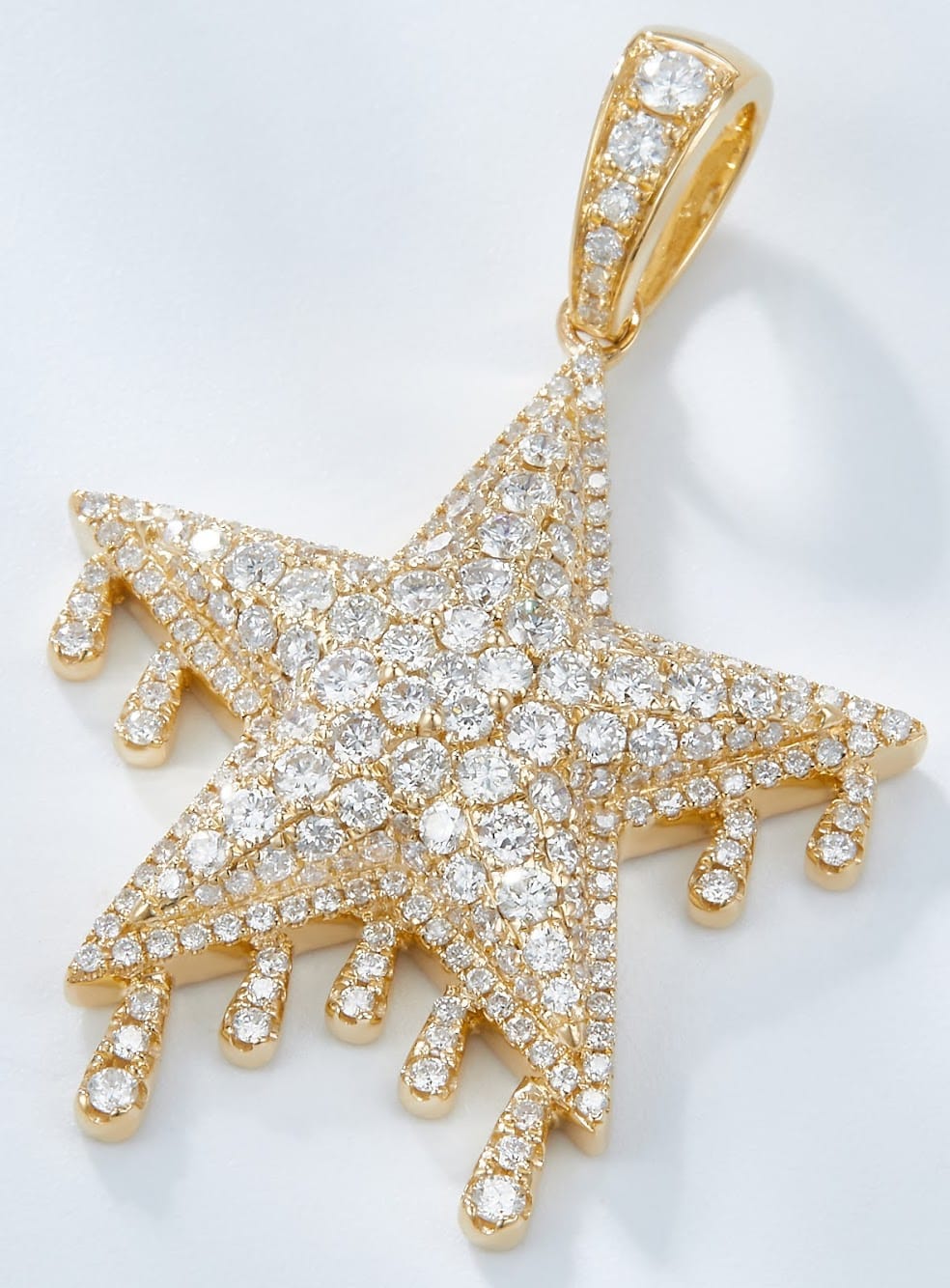 a gold with diamonds custom star pendant