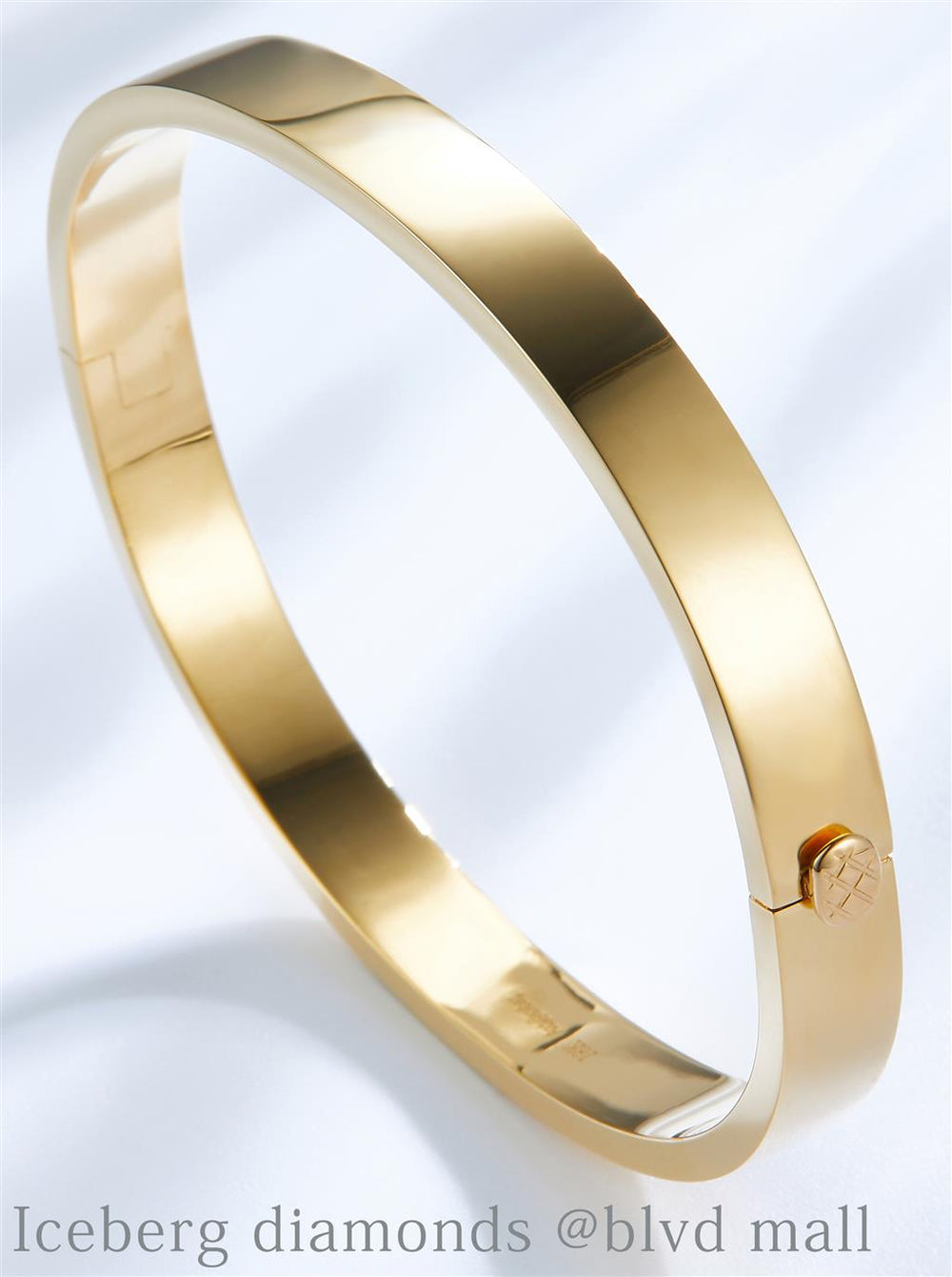 Yellow gold plain hard bangle oblong bracelet