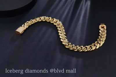 0.61 Ct. Diamond 14 Kt Gold (Yellow). Solid Cuban Link Bracelet. (Men). 9 in Long. 10 mm Wide