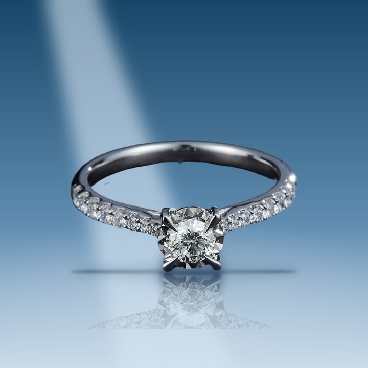 0.56 Carats. Diamond 14 Kt Gold (White). Solitaire with Cent