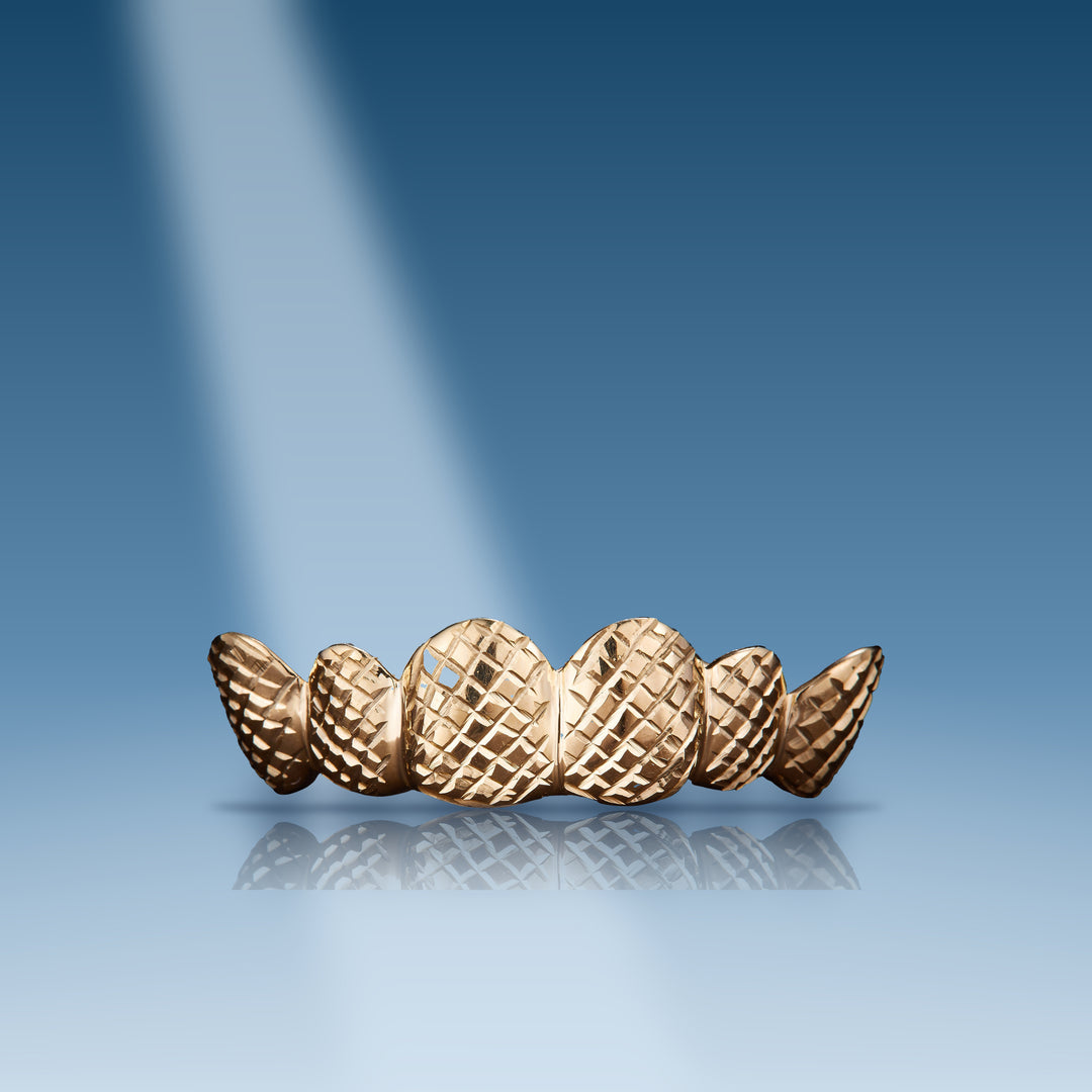 diamond-cut-gold-grillz-fangs